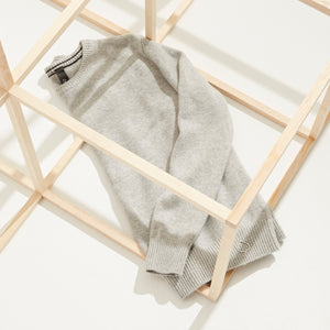 Men's cashmere sweater inside wooden frame, at Aspen Collection