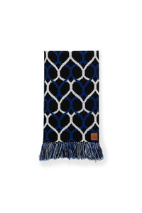 Navy blue and white patterned scarf with fringes on a white background