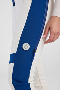 Close-up of a white and blue jacket with a brand logo on a white background