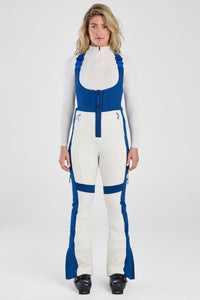 Person wearing a white and blue jumpsuit on a white background