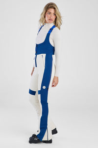 Person wearing a white and blue jumpsuit on a white background