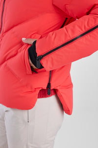Red puffer jacket with black zipper on a white background