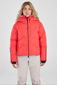 Person wearing a bright red puffer jacket on a white background