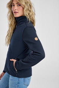 Woman wearing a black jacket with a brand logo on a white background