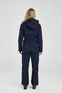 Person wearing a navy blue snowsuit on a white background