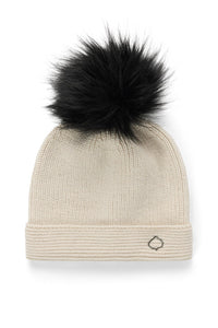 Beige knit beanie with a black faux fur pom-pom on a white background