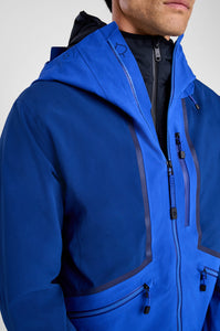 Blue jacket with a hood worn by a person on a white background