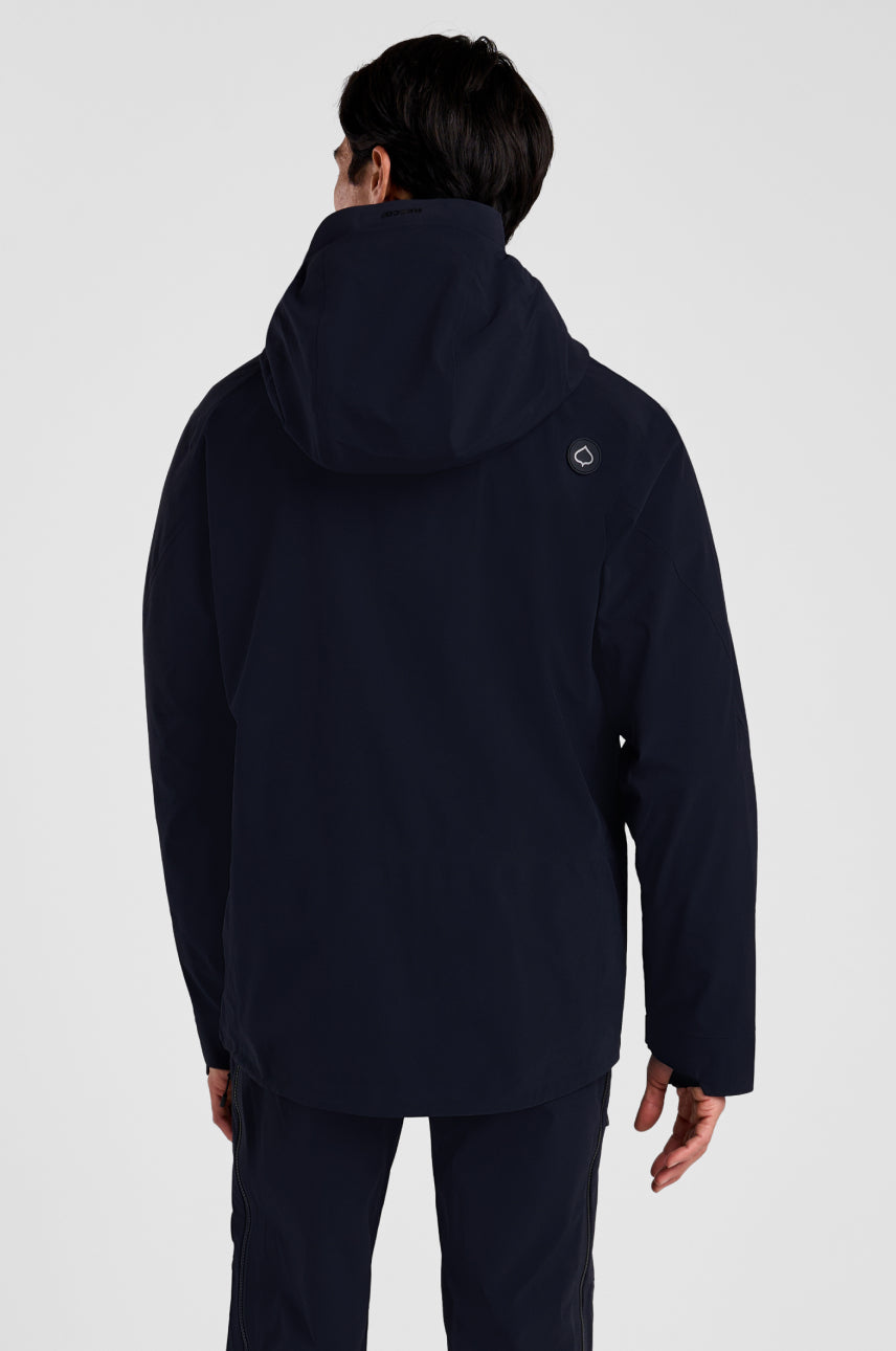 Person wearing a black hooded jacket on a white background