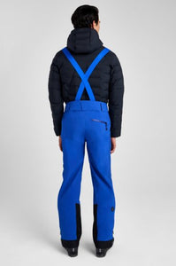 Person wearing a black jacket and blue pants on a white background