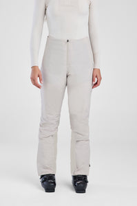 Person wearing beige pants and a white top on a white background