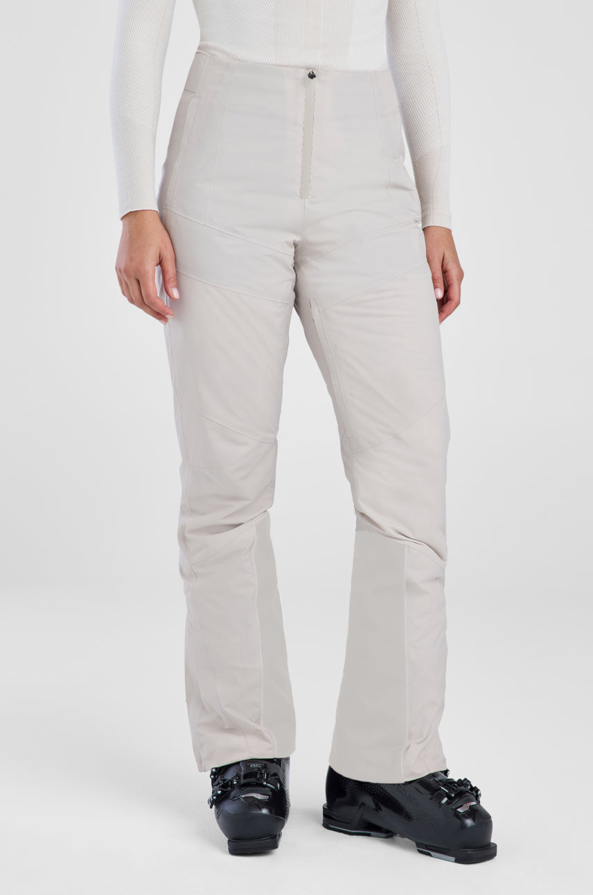 Beige pants worn by a person on a white background