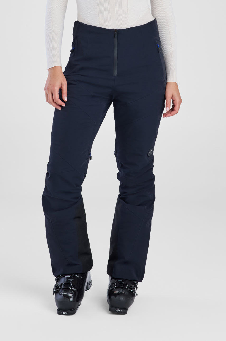 Person wearing navy ski pants on a white background