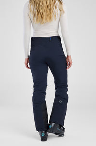 Person wearing navy ski pants on a light gray background