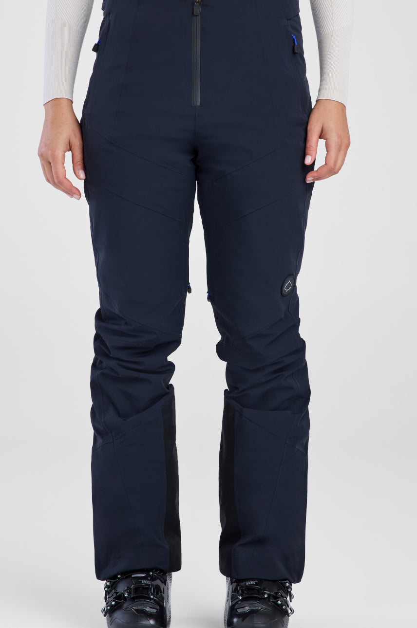 Navy ski pants worn by a person on a white background