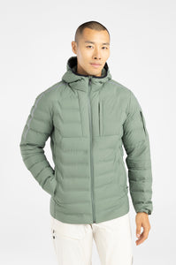 Man wearing a green puffer jacket on a white background