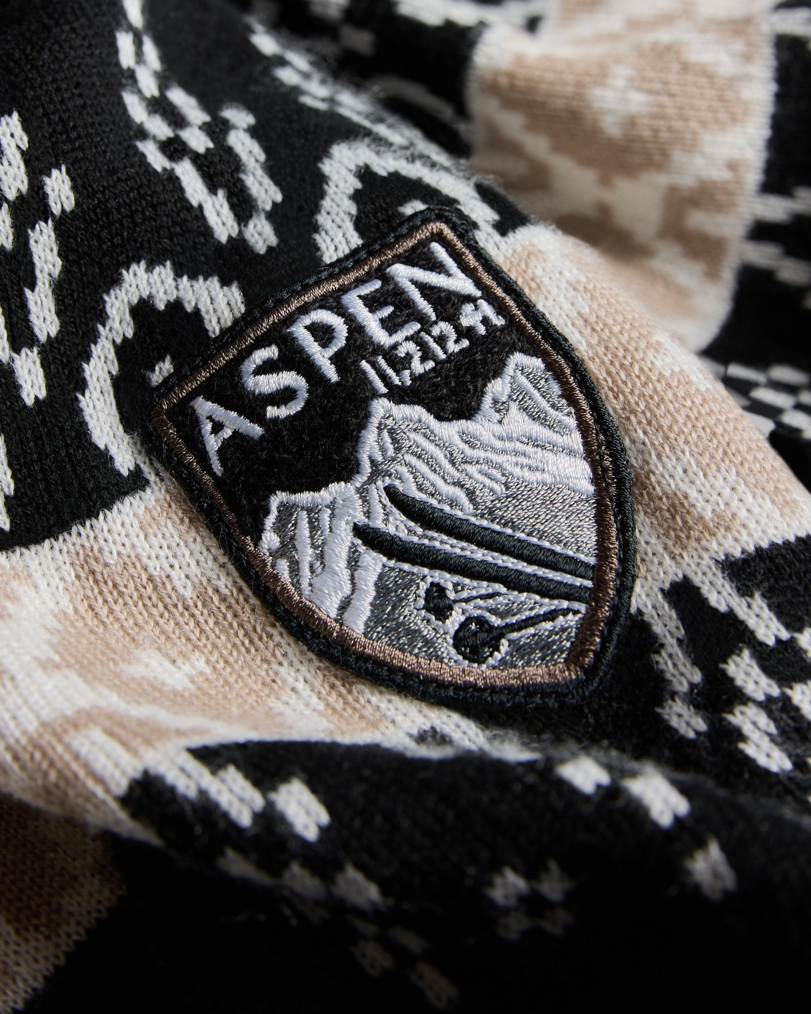 Aspen Glade Sweater Women's, Black Color, close up of the aspen patch on shoulder of sweater