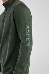 Green sweater with 'Aspen' branding on a light gray background