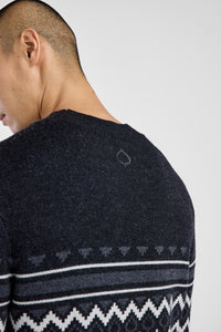 Close-up of the back of a black sweater with aspen leaf logo