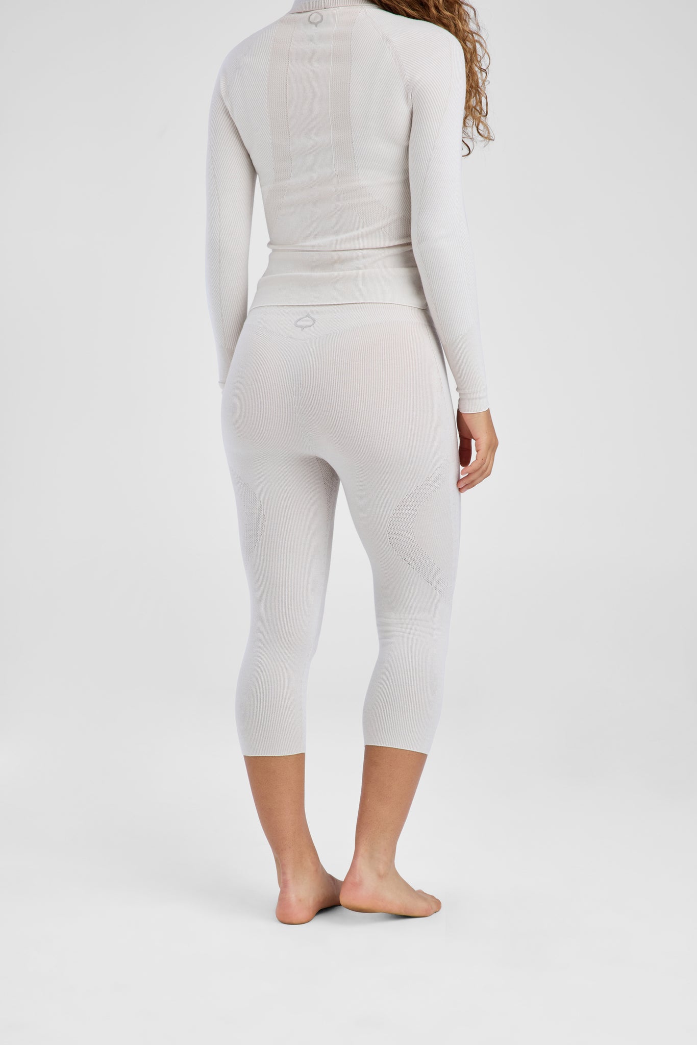 Back of beige baselayer set on model