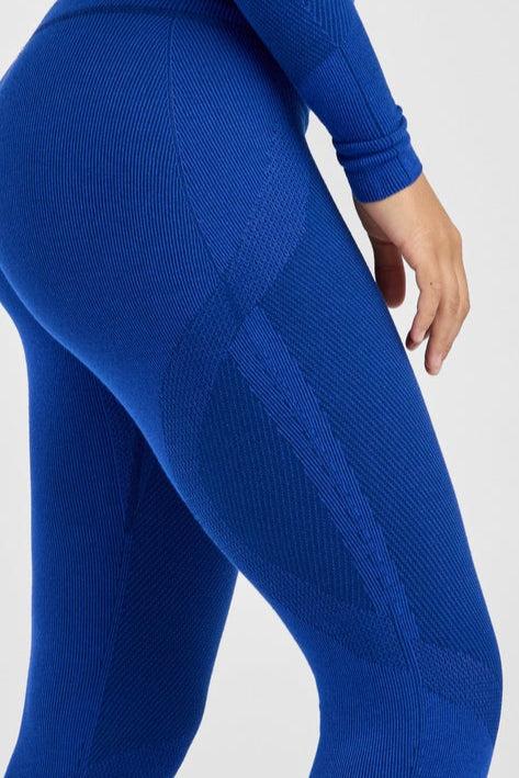 Person wearing a blue outfit on a white background