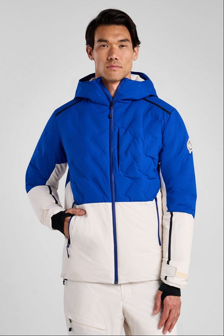 Person wearing a blue and white ski suit on a gray background