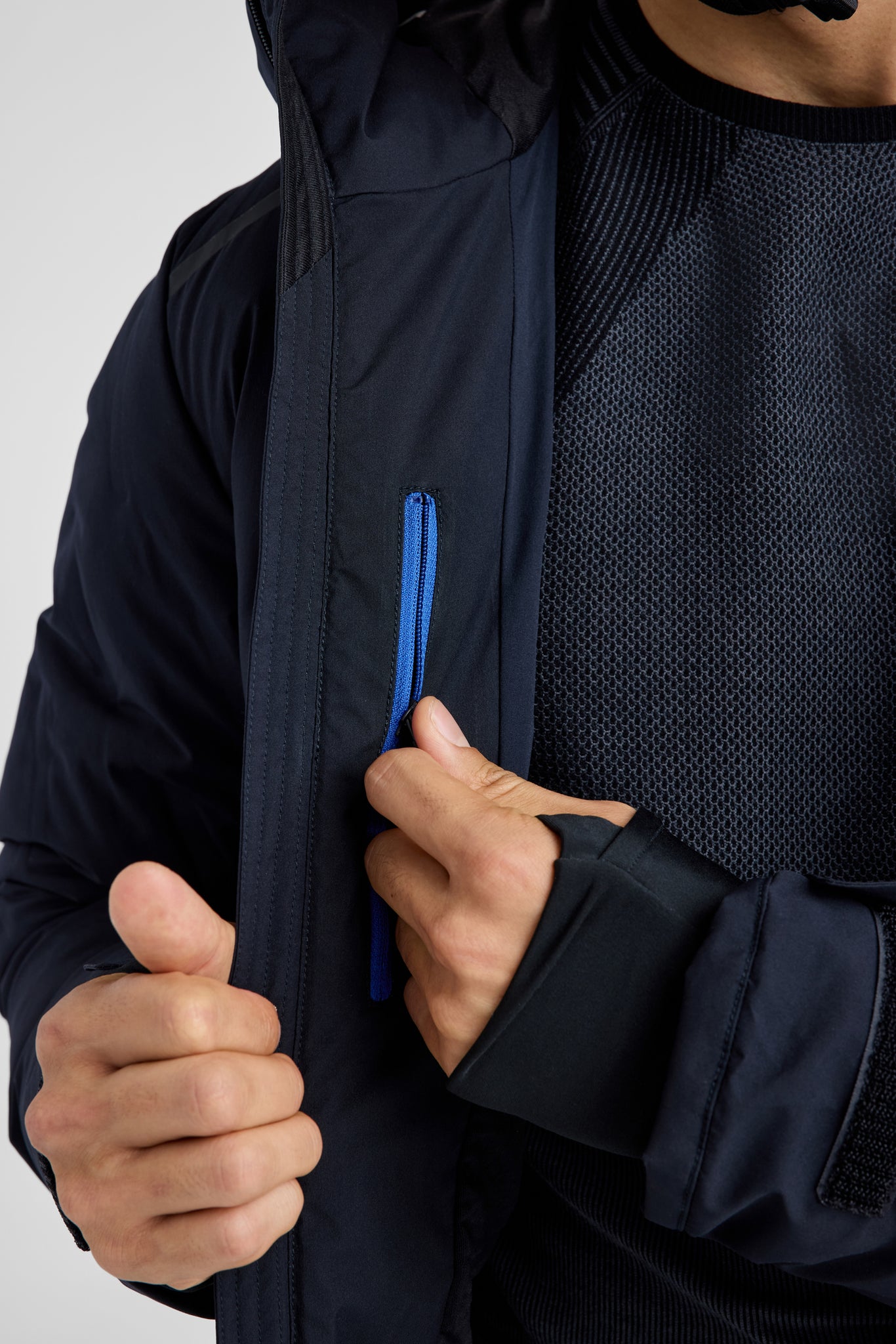 Details of a zipper on a black ski jacket