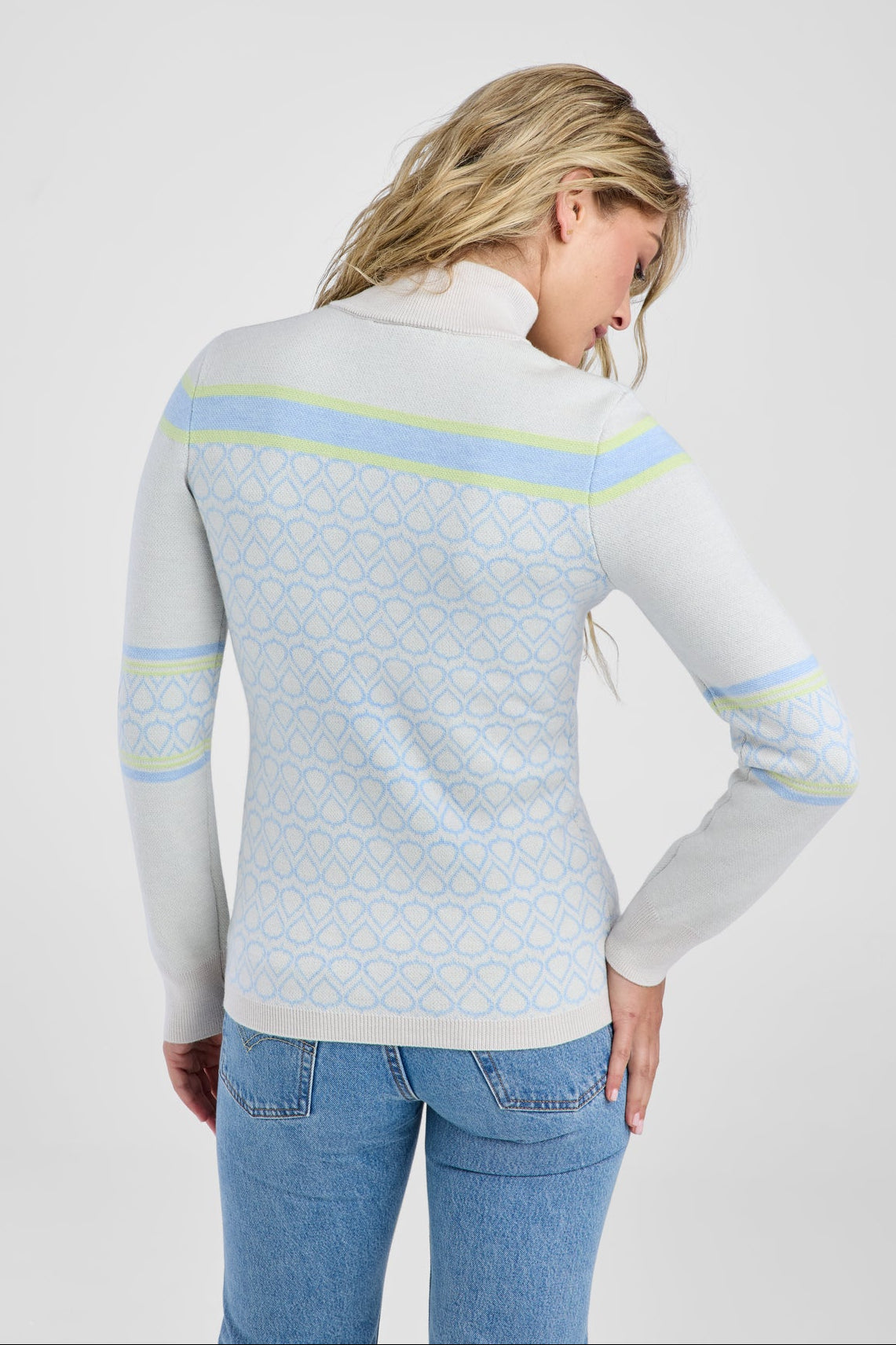 Women in white and light blue patterned sweater