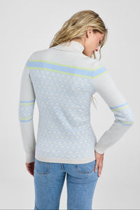Women in white and light blue patterned sweater