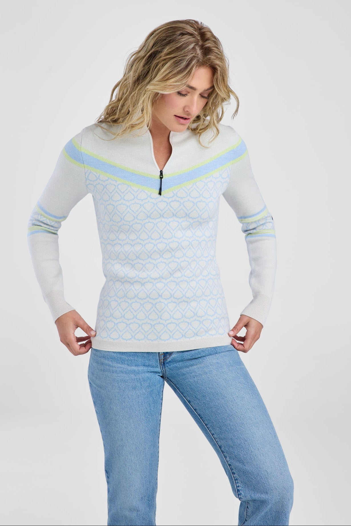 Women in white and light blue patterned sweater
