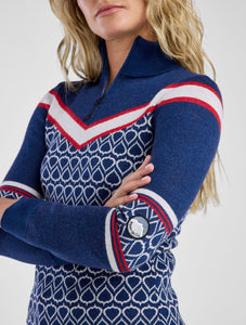 Women in navy and red patterned sweater