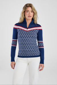 Women in navy and red patterned sweater